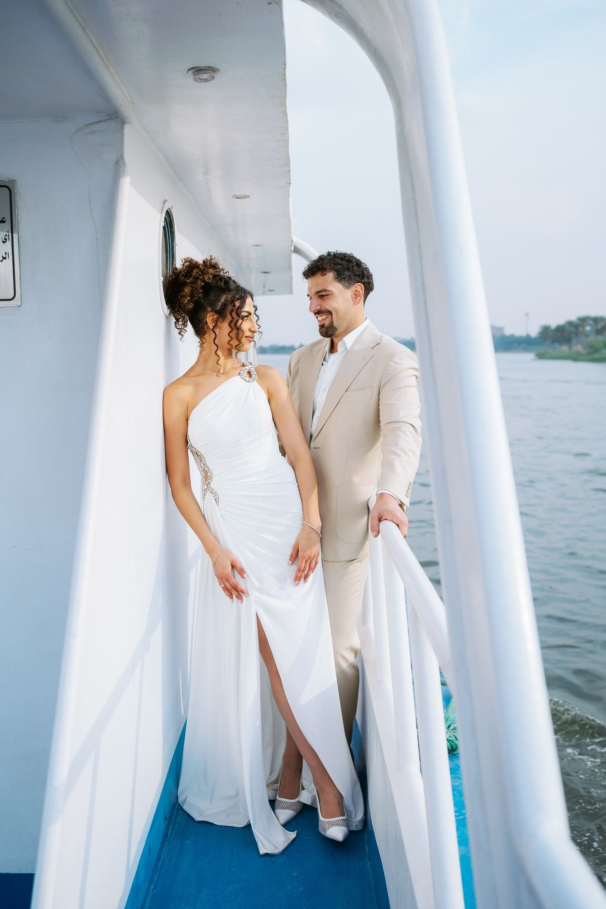 Salma and Anas on the deck of a boat on the Nile